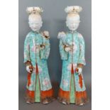 A pair Chinese Qianlong period Famille Rose nodding head figures, each decorated in polychrome