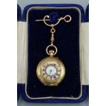 A 9ct gold fob watch with 9ct gold suspension pin, 22.4 gms including movement