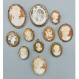 A late 19th Century cameo brooch decorated in relief with figures in a landscape together with ten