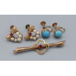 A pair of 9ct gold ruby and pearl set earrings together with another pair of 9ct gold earrings set