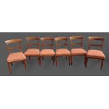 A set of six William IV mahogany dining chairs, each with a rail back above stuffover seats raised