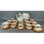 A Royal Albert Old Country Roses tea service, comprising ten cups and saucers, hot water pot,