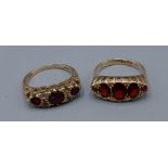 A 9ct gold ring set five garnets together with a similar 9ct gold garnet set ring, 6.8gms, ring size