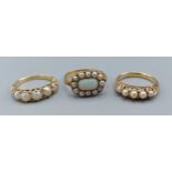 A Victorian opal and pearl set ring together with two rings each set with five pearls