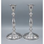 A pair of Birmingham silver candlesticks with circular pedestal bases, 26.5cms tall