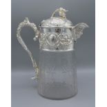 A silver plated and cut glass claret jug decorated with grape vine and figural spout, 26cms tall