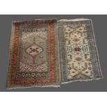 A Northwest Persian woollen rug with an all-over design upon a red, blue and cream ground together