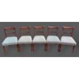 A set of five Regency mahogany dining chairs, each with a rope twist back above a padded seat raised