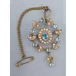 A 9ct gold brooch set with seed pearls and aquamarine, 4.9gms