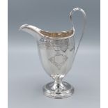 A George III silver cream jug with engraved decoration, London 1797, maker Charles Aldridge, 6ozs,