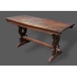 An oak refectory style dining table, the plank top above twin end supports with stretcher, 149cms