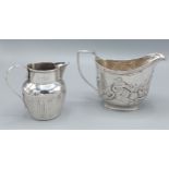 A George III silver sauce jug together with a Victorian London silver jug, 7ozs
