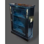 A Victorian ebonised and gilt metal mounted pier cabinet, with a glazed door raised upon a plinth,