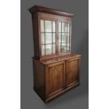 A 19th Century mahogany bookcase, the moulded cornice above two astragal glazed doors, the lower
