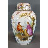 A German porcelain covered vase decorated with figures amongst foliage, 33cms tall