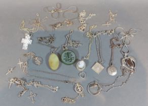 A cameo pendant with chain, together with a collection of mainly silver pendants and chains