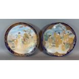 A pair of Satsuma earthenware dishes, each decorated with figures decorated with polychrome