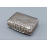 A George IV silver vinaigrette, the hinged cover enclosing a gilt pierced grill, Birmingham 1832,