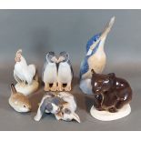 A Royal Copenhagen porcelain model of two Penguins together with three other Royal Copenhagen groups