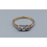 An 18ct gold three stone diamond ring, claw set, 1.9gms, ring size O