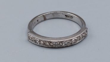 An 18ct white gold and diamond set half eternity ring, ring size L, 3.7gms
