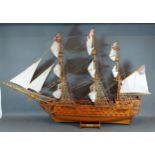A scale model of H.M.S Victory 1805, upon a stand, 69cms tall