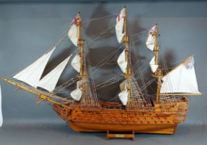 A scale model of H.M.S Victory 1805, upon a stand, 69cms tall