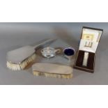 A Birmingham silver backed two piece dressing table set together with a Birmingham silver salt and