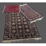 A Northwest Persian woollen rug with an all-over design within multiple borders, 174cms x 115cms