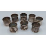 A set of eight white metal napkin rings, 6ozs