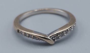 An 18ct white gold ring set with diamonds, ring size I, 2.2gms, one stone missing