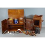 A Victorian oak smokers cabinet, the contents to include four pipes together with another similar