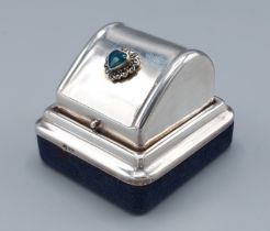A London silver ring box, the hinged cover inset with a green enamel heart