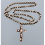 A 9ct gold crucifix pendant with 9ct gold linked neck chain, 47cms long, 12.2gms