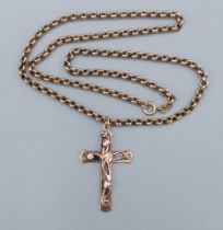 A 9ct gold crucifix pendant with 9ct gold linked neck chain, 47cms long, 12.2gms