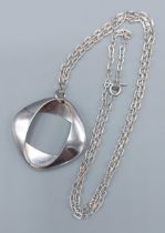 Georg Jensen, a silver pendant of stylised form with silver linked chain