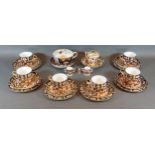 A set of six Royal Crown Derby Imari pattern tea cups and saucers, together with matching side