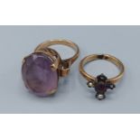 An unmarked dress ring set with an Amethyst and four pearls together with an Amethyst set dress ring