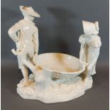 A Royal Worcester Hadley group depicting two figures with a large basket, 27cms tall