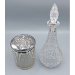 A London silver and cut glass large jar decorated Whispers together with a cut glass decanter and