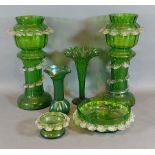 A pair of green glass vases together with a Loetz type vase, another green glass vase and two dishes
