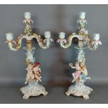 A pair of Meissen porcelain candelabrum, each mounted with Putti decorated in polychrome enamels and