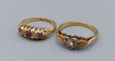 An 18ct gold ruby and diamond set ring, 1.8gms together with an unmarked diamond set ring, 2.8gms