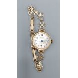 A 9ct gold cased ladies wristwatch by Excalibur with 9ct gold strap, 8.8gms excluding movement