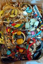 A large collection of jewellery to include bead necklaces, bangles and other jewellery