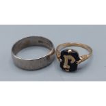 An 18ct white gold wedding band, 5.6gms together with a 9ct gold mourning ring, 1.5gms