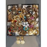 A pair of earclips by Gianni Versace together with a large collection of earclips