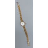 A 9ct gold cased ladies wristwatch by Longines with 9ct gold strap, 15gms