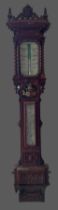 A Victorian oak barometer/thermometer by Negretti and Zambra, the carved case with central painted