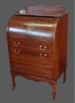 An Edwardian Sheraton revival cylinder bureau, the painted front above four drawers with brass